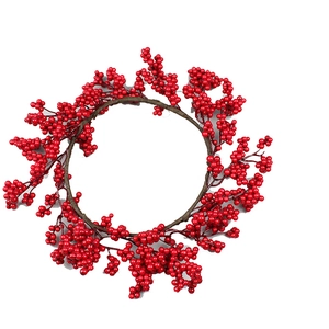 Artificial Christmas wreath featuring dense red berries and brown branches on white background