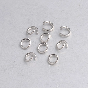 Macro detail of polished stainless steel open jump rings for jewelry making