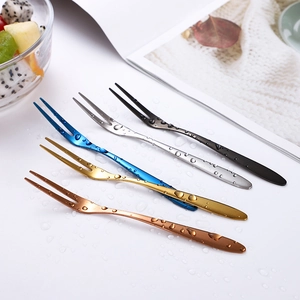 Five 304 stainless steel two-prong fruit forks in various colors with water droplets