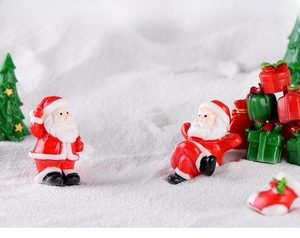 Miniature Christmas resin figurines set featuring Santa Claus, tree, and gift boxes