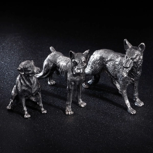 Three premium silver stainless steel dog sculptures with realistic metallic texture detailing