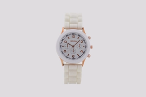 Detail of white silicone strap and rose gold buckle on Geneva three-eye women's watch