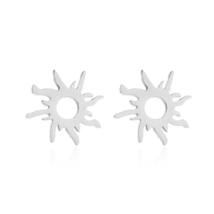 Close-up of silver hollow sunburst stud earrings with polished wavy rays