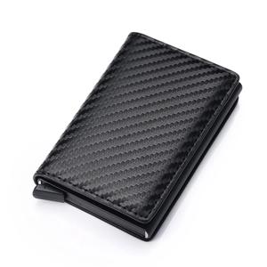 Detail of slim carbon fiber RFID blocking card holder with automatic pop-up lever mechanism