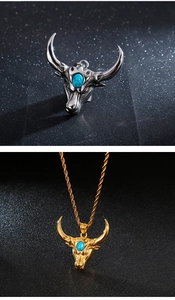 Macro detail of bull head pendant necklace in gold and silver finish with turquoise stone