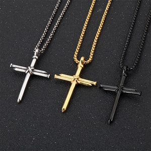 Three men's titanium steel cross nail necklaces in silver, gold, and black finishes