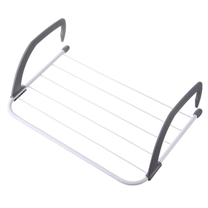 Foldable white radiator drying rack with adjustable grey arms for laundry and shoes