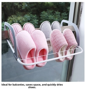 Detail of white metal balcony shoe drying rack showing its four-tier hanging structure