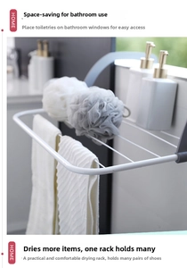 Close-up of white metal drying rack hanging in bathroom with towels and bottles