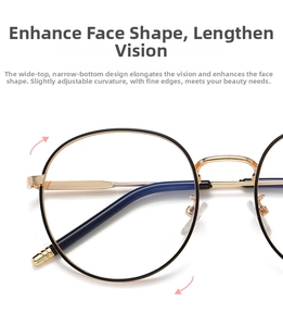 Detail of vintage round metal glasses frames in black and gold showing nose pads and bridge