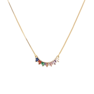Fashionable gold necklace featuring a curved pendant with colorful rainbow zircon stones