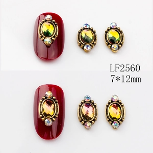 Close-up of LF2560 7x12mm vintage oval nail art charms with colorful rhinestones