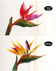 Macro detail of artificial bird of paradise flowers in vibrant red and orange colors