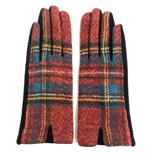 Detail view of Scottish plaid woolen gloves with red, blue, and yellow checkered pattern