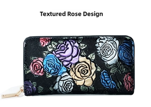 Close-up of 3D embossed colorful rose patterns on black grainy leather wallet with gold zipper