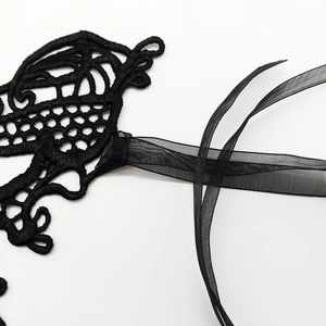 Elegant black lace masquerade mask with sheer organza ribbons for party costumes