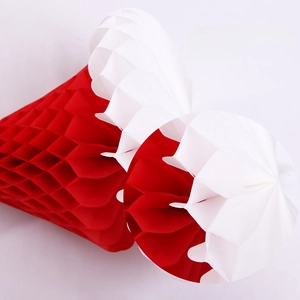 Close-up of red and white honeycomb paper ball ornament for Christmas party decoration