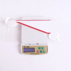 Weight measurement of festive honeycomb paper Christmas hat decoration at 29g