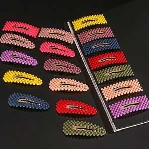 Set of 15 colorful pearl-textured teardrop hair clips for women in vibrant shades