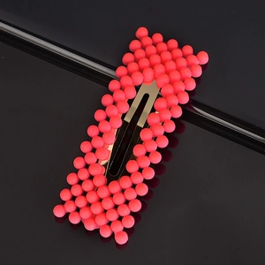Detail showing pink matte pearl beads on a golden metal BB hair clip for women