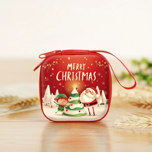 Detail of red square Christmas coin purse featuring Santa Claus print and zipper handle