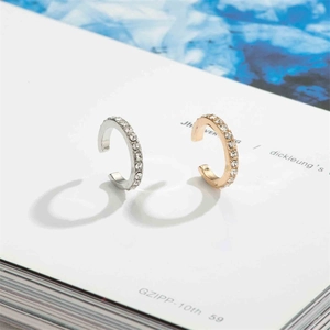Minimalist U-shaped ear cuffs in gold and silver finish with sparkling pave zircons