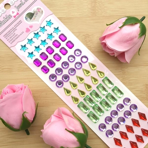 Detail of multi-shaped self-adhesive crystal rhinestone stickers in vibrant colors
