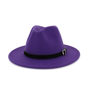 Macro detail of dark purple wool fedora hat with black leather band and metal buckle