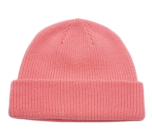Detailed view of the thick pink knit texture and warm yarn pattern of the beanie