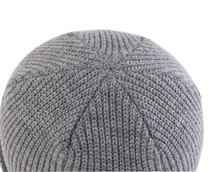 Macro detail of the top knitting structure and texture of the grey knit beanie hat
