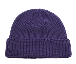 Detailed knit texture of a dark purple ribbed beanie with a cuffed brim design