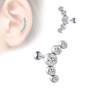 Macro detail of silver curved ear stud featuring five sparkling round-cut clear crystals