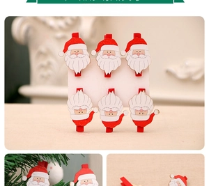 Dettaglio di sei mollette in legno di Babbo Natale per decorazioni natalizie DIY