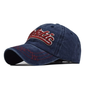 Detail of washed navy cotton baseball cap with 3D Athletic embroidery and red wave brim line