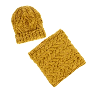 Detailed close-up of thick mustard yellow knit hat and neck warmer scarf set
