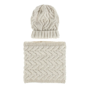 Detailed knit texture of beige cable-knit winter beanie and matching neck gaiter set