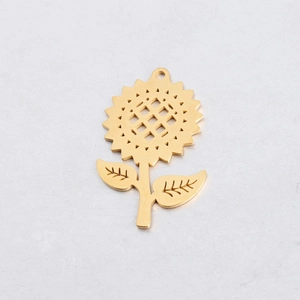 Macro shot of 31x50mm golden sunflower pendant with detailed hollow engraving