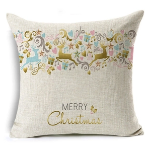 Detail of Christmas linen pillowcase featuring reindeer patterns and Merry Christmas text