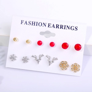 Detail view of 6-pair Christmas stud earrings set with snowflake and reindeer motifs