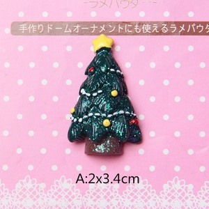 Detail of glittery green resin Christmas tree charm with colorful dots and 2x3.4cm size
