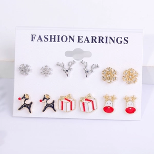 Close-up of 6-pair Christmas stud earrings set including snowflakes and reindeer on card