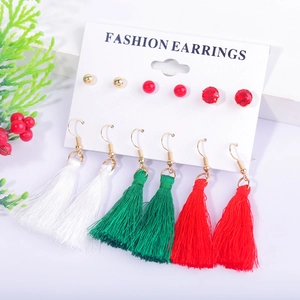 Detailed view of 6-pair Christmas earring set with tassels and studs on display card