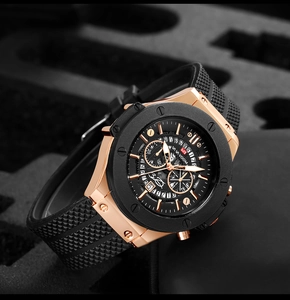 Close-up of skeleton dial chronograph watch with gold case and black rubber strap