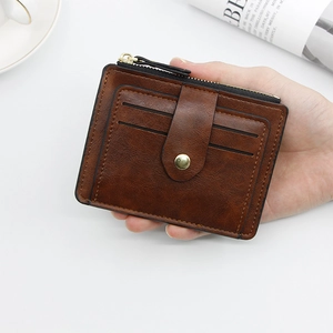 Handheld vintage brown leather multi-card wallet with zipper coin pocket and gold button