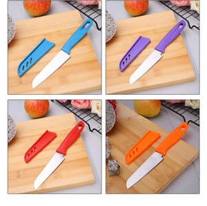 Macro display of assorted colorful stainless steel fruit knives with matching protective sheaths