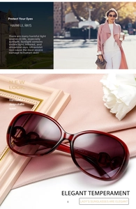 Detail of oversized dark red tortoiseshell sunglasses with gradient purple lenses