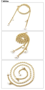 Detail of elegant gold layered chain belt with white pearl pendant and lobster clasp