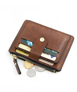 Brown leather wallet detail showing the large cash slot and multiple credit card holders
