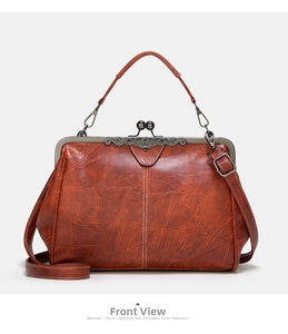 Front view of retro doctor style handbag in rust red leather with vintage bronze clasp