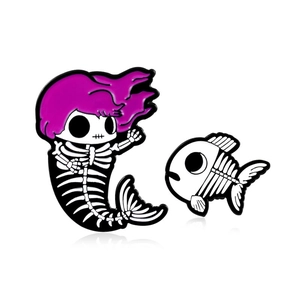 Enamel pin set with a pink hair skeleton mermaid and a matching black white fishbone